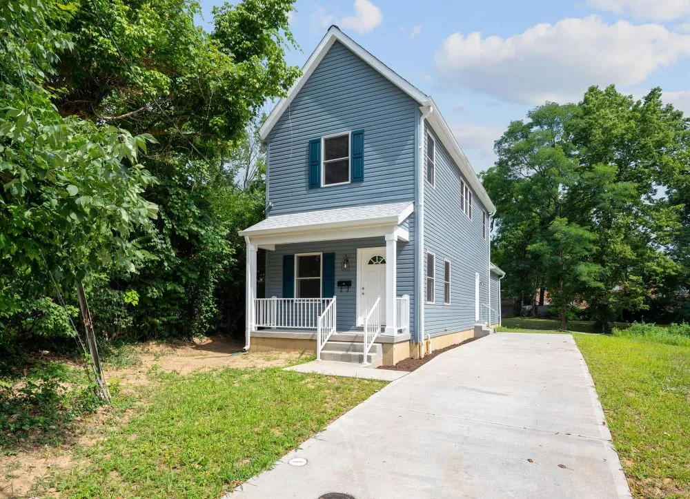 A blue house located at 5917 Piqua Avenue, built by WIN to be sold to a first-time homebuyer