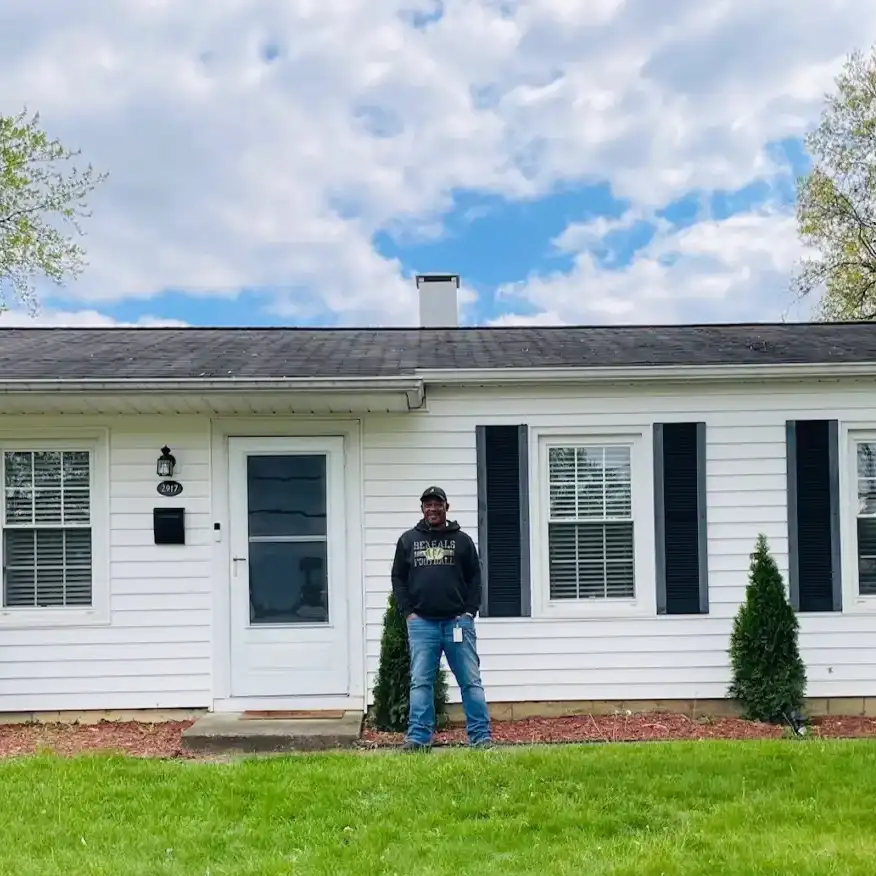 Mark Stenson stands proudly in front of his new house in Colerain.