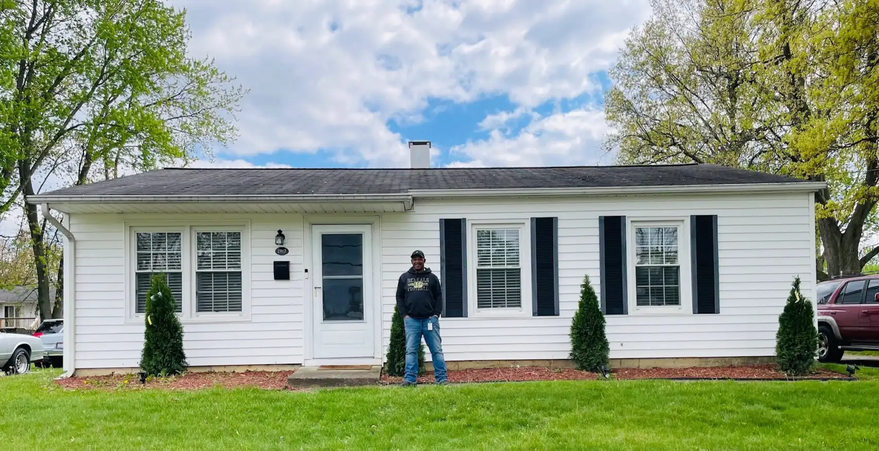 Mark Stenson stands proudly in front of his new home in Colerain. 